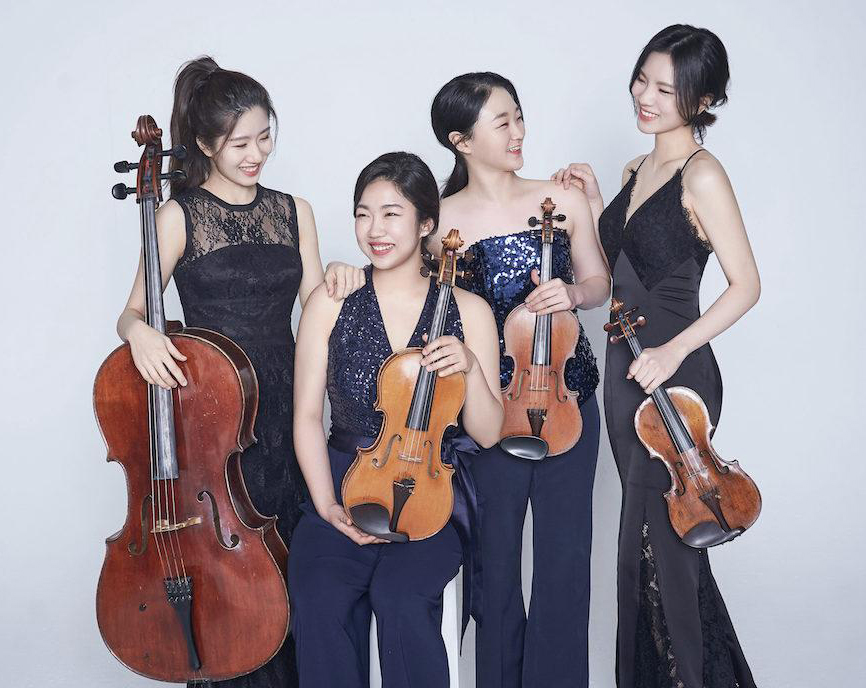 Four young women of Asian ancestry dressed in elegant clothing and holding various stringed instruments.