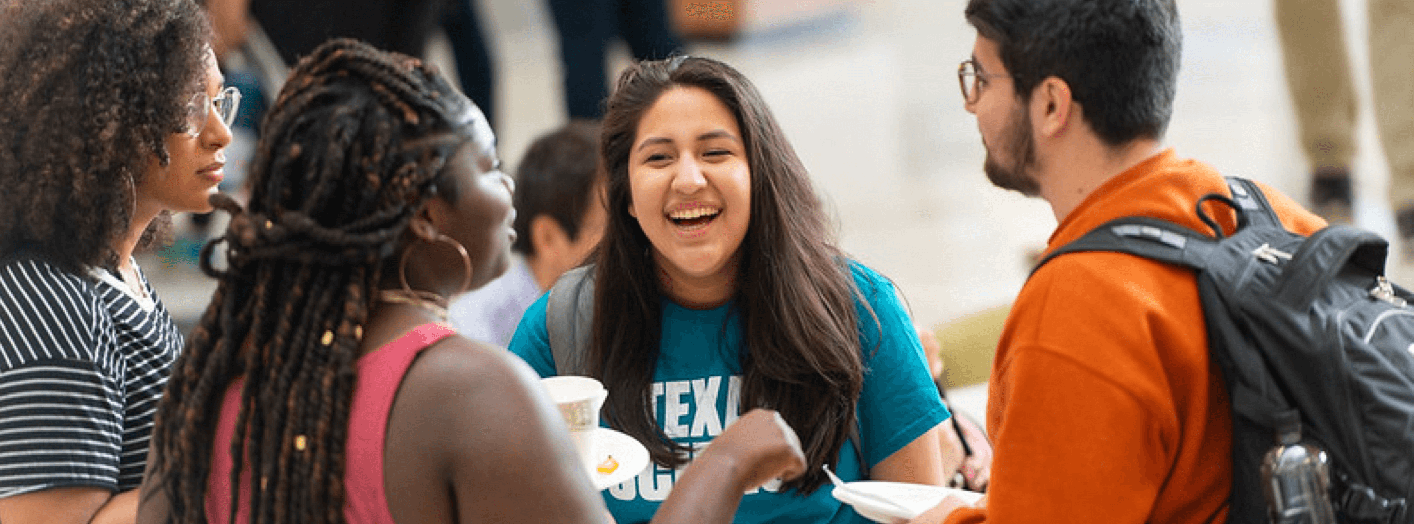 undergraduate students laughing and talking